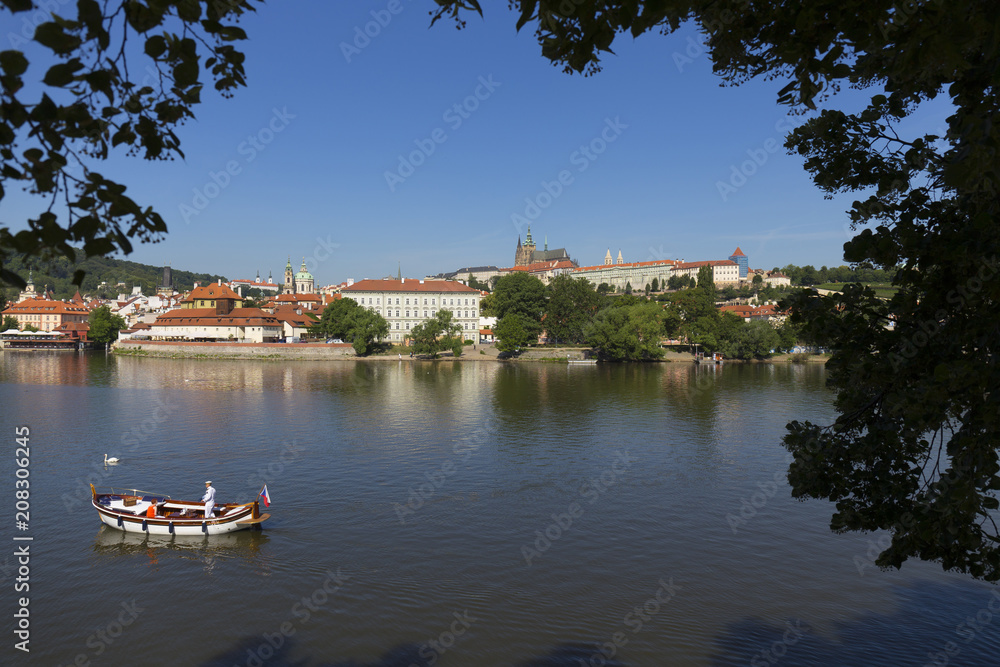 Spring Prague gothic Castle with the Lesser Town above River Vltava in the sunny Day, Czech Republic