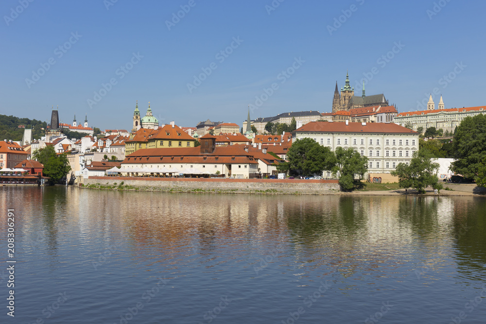 Spring Prague gothic Castle with the Lesser Town above River Vltava in the sunny Day, Czech Republic