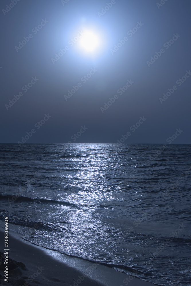 Fototapeta premium Fantastic blue sea background. Mediterranean Sea at night. Moon reflecting in a sea