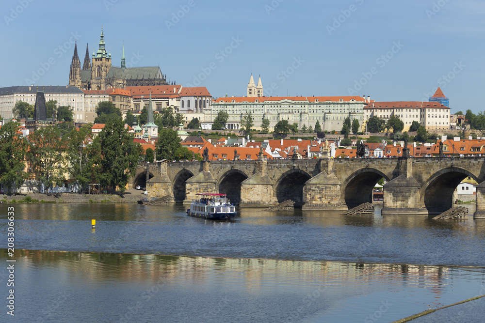 Obraz premium Spring Prague gothic Castle with the Lesser Town above River Vltava in the sunny Day, Czech Republic