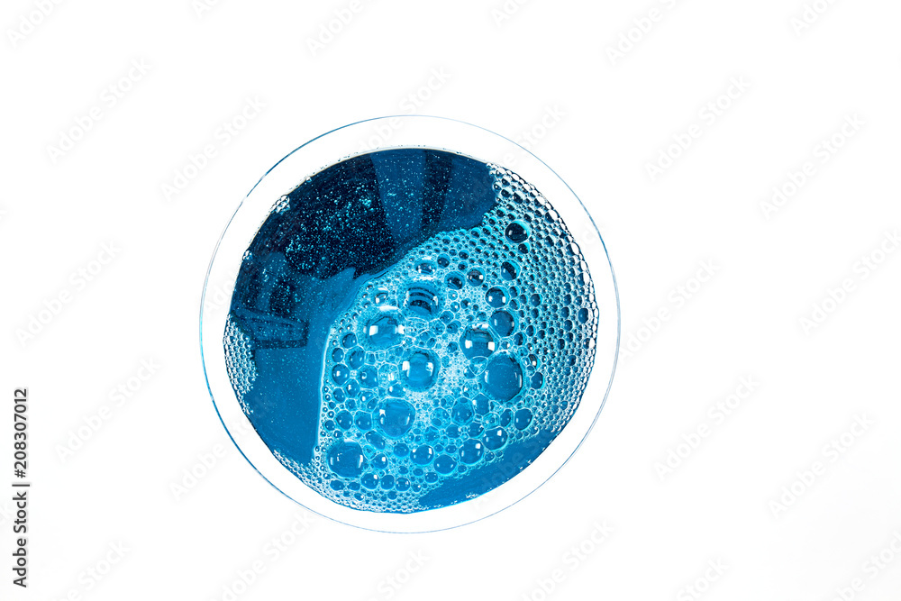 Circle of blue liquid bubbles above a cocktail drink glass Circle of blue liquid bubbles above a cocktail drink glass