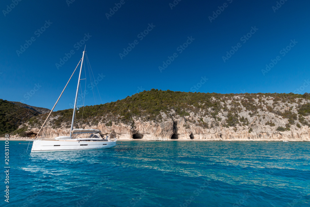 Cala Luna beach and sailing boat from seaside