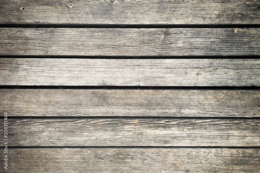 Wooden background with grey horizontal planks. Old and rough wood texture Wooden background with grey horizontal planks. Old and rough wood texture