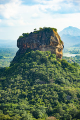 Spectacular view of the Lion rock surrounded by green rich vegetation. Picture taken from Pidurangala Rock in Sigiriya, Sri Lanka.