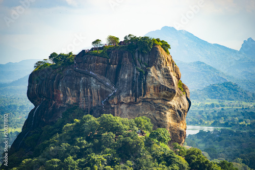 Obraz na płótnie Spectacular view of the Lion rock surrounded by green rich vegetation. Picture taken from Pidurangala Rock in Sigiriya, Sri Lanka. w salonie