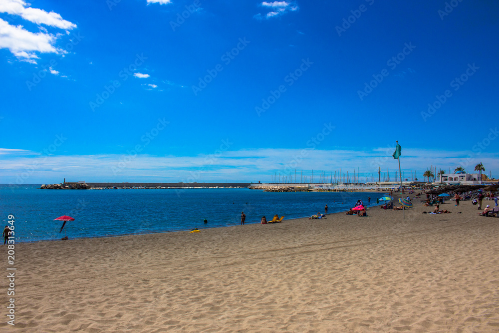 Obraz premium Beach. A sunny day on the beach of Fuengirola. Malaga province, Andalusia, Spain. Picture taken – 5 june 2018.