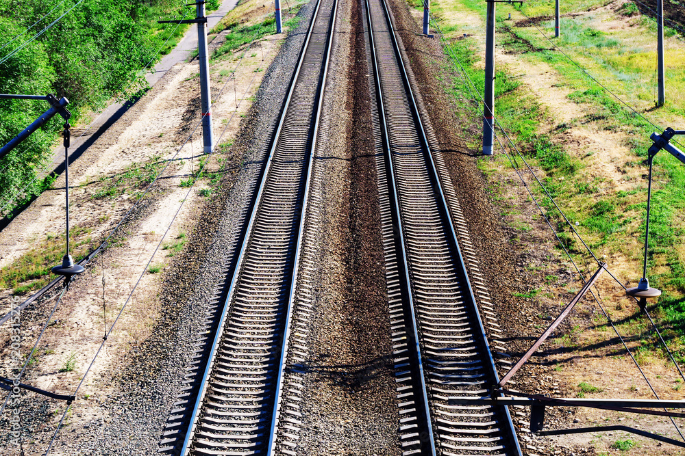 Old abandoned rustic rails for trains. Concept of security and timely verification Old abandoned rustic rails for trains. Concept of security and timely verification