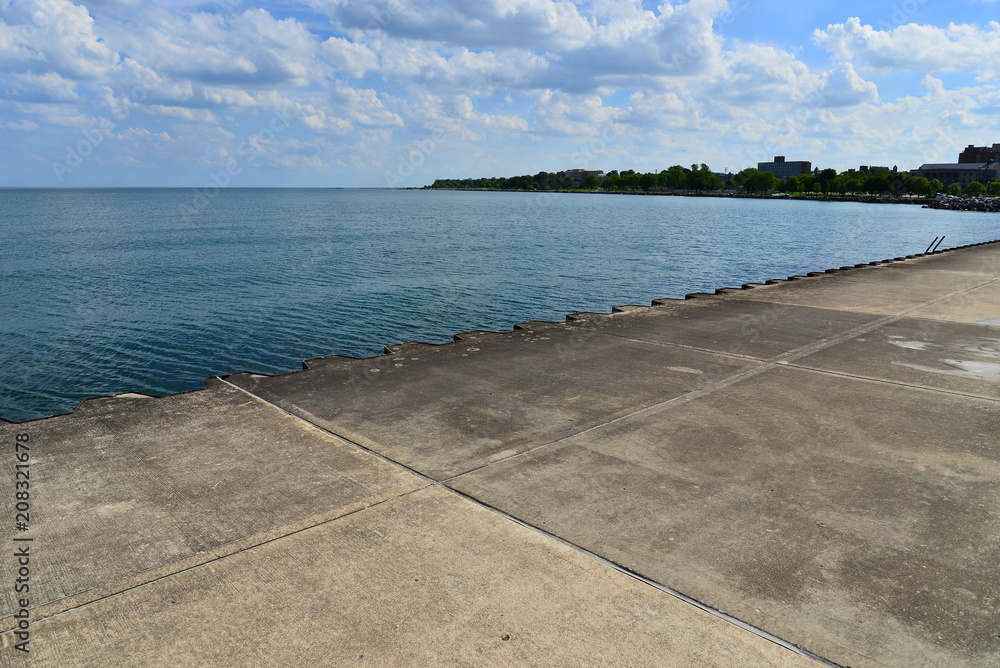 A view looking south from the pier on Lake Michigan with the horizon in the distance. 