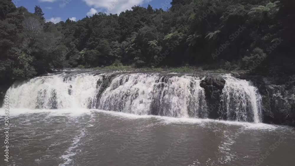 Wharepuke Falls in Kerikeri near trading post, aerial pan ungraded dlog color. Wharepuke Falls in Kerikeri near trading post, aerial pan ungraded dlog color.
