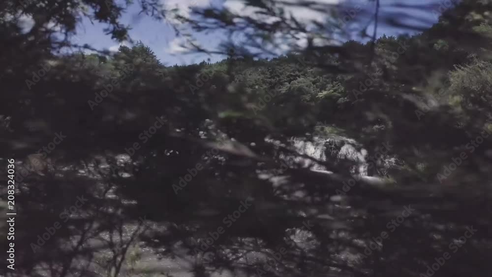 Drone crash, quad copter flying backwards for aerial view of waterfall crashes into unseen trees behind by careless operator. Drone crash, quad copter flying backwards for aerial view of waterfall crashes into unseen trees behind by careless operator.