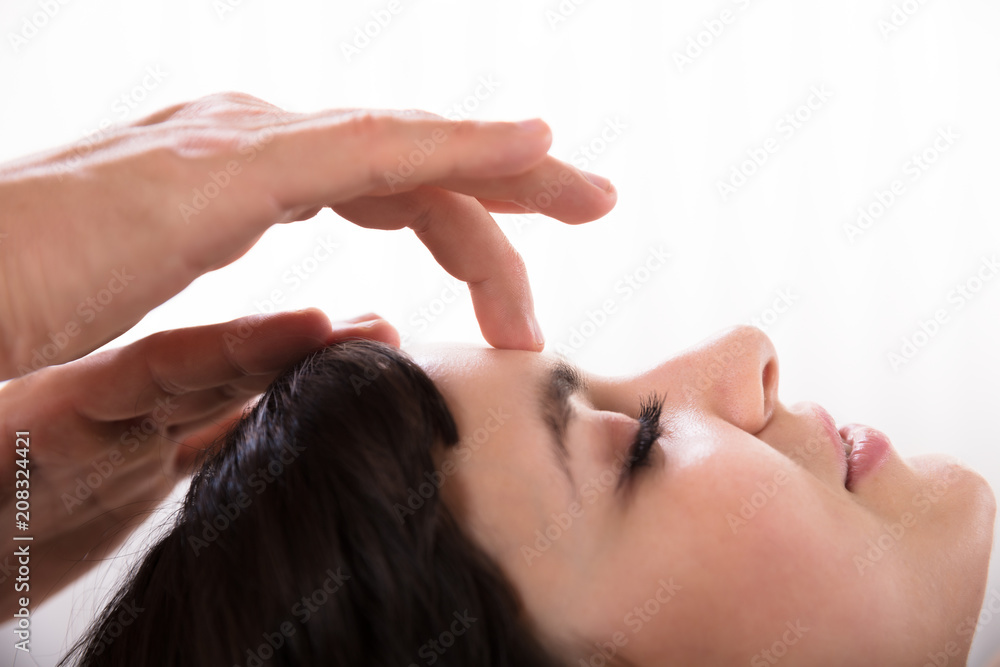 Fototapeta premium Calm Woman Receiving Reiki Treatment