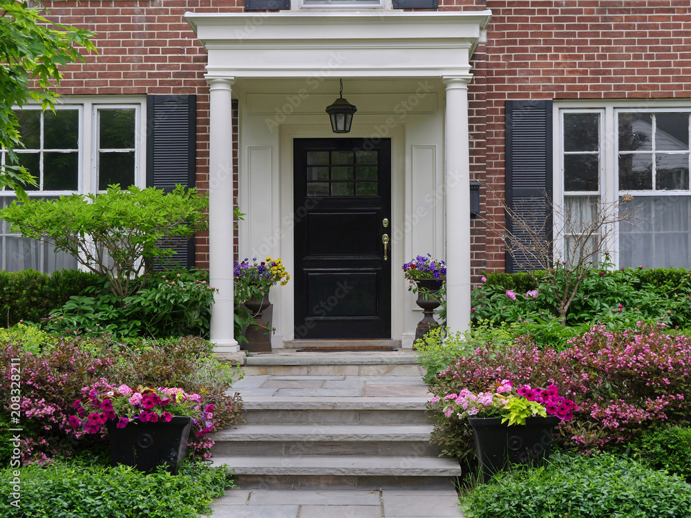 Naklejka premium front door of house with portico entrance