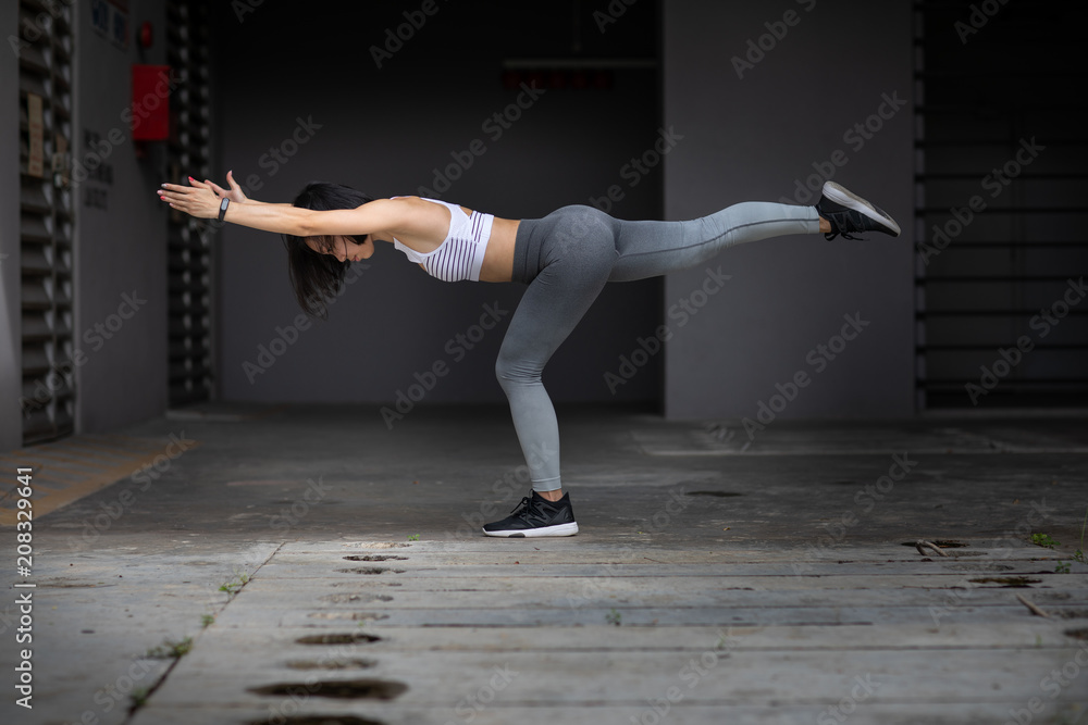 Young woman in a balancing pose