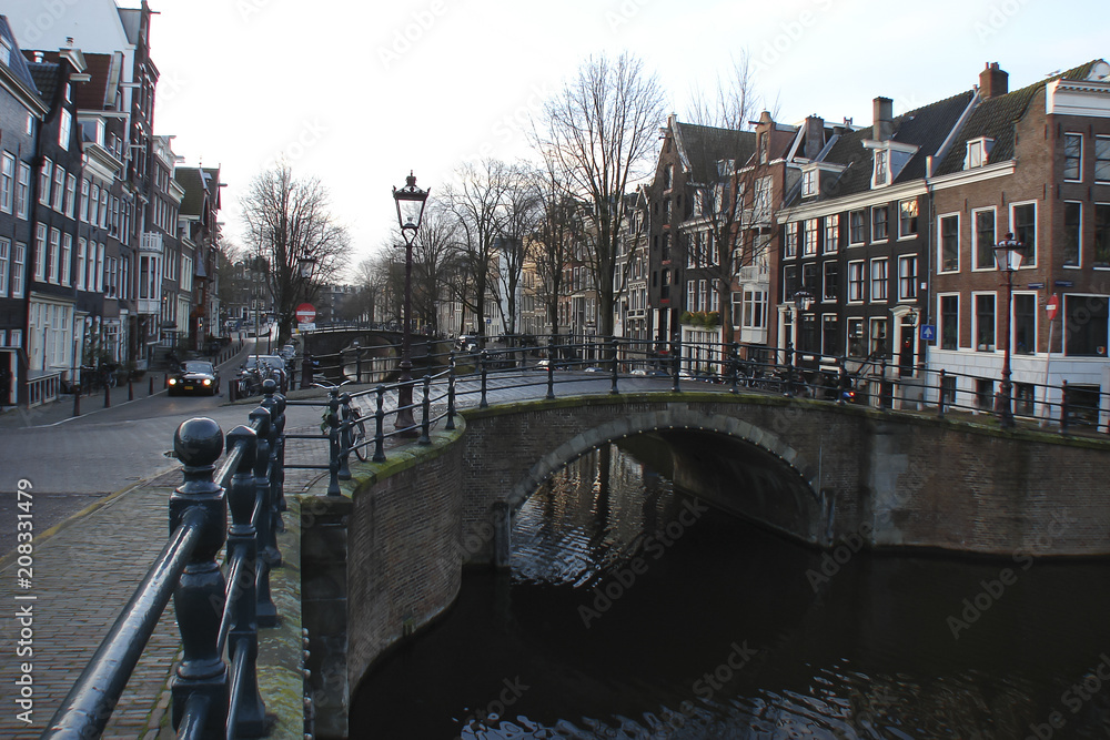 desert streets of morning Amsterdam, canals and bridges, Netherlands