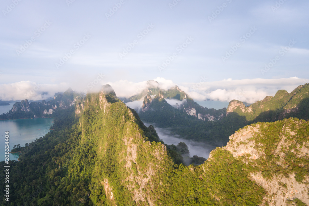 Rainforest with limestone mountains surrounding. Sunrise In the south of Thailand
