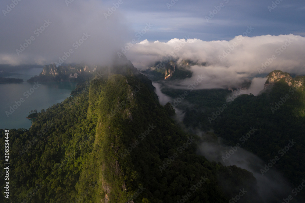 Rainforest with limestone mountains surrounding. Sunrise In the south of Thailand