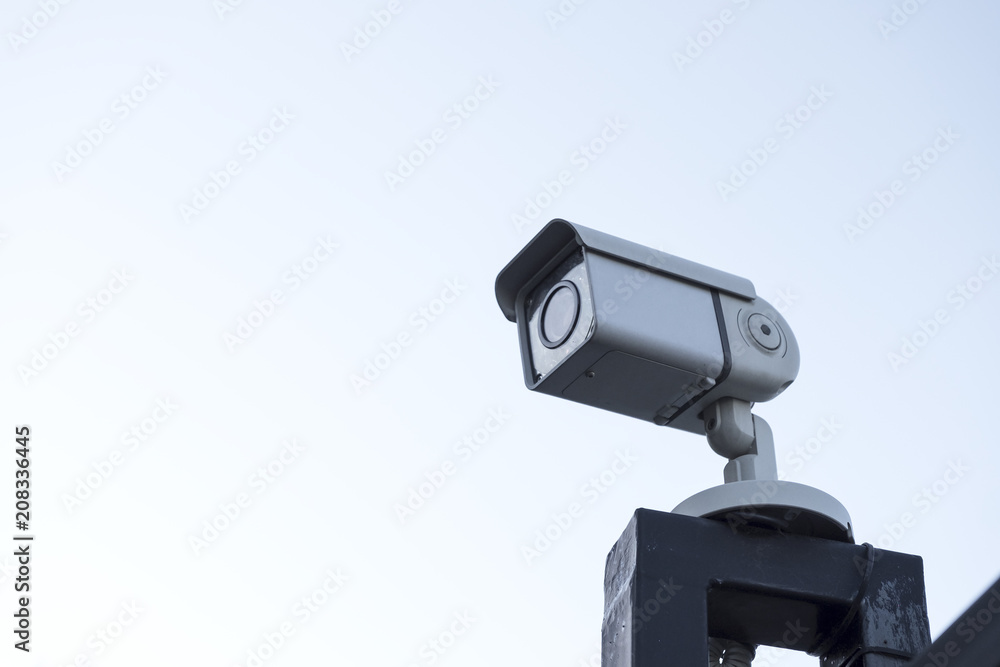 Street surveillance camera on the fence. Street surveillance camera on the fence.