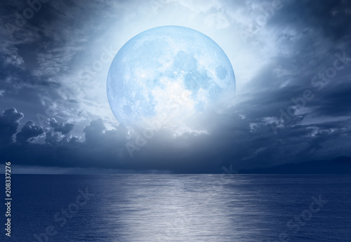 Night sky with moon in the clouds "Elements of this image furnished by NASA