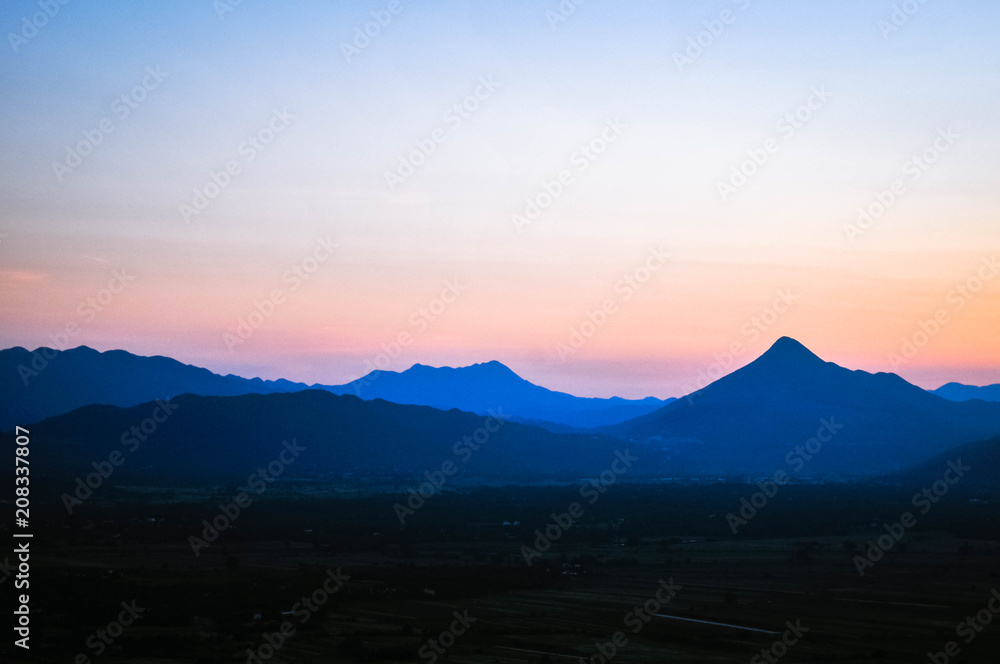 Sunset in Bosnia and Herzegovina. View of the mountains and over the city. June 2018