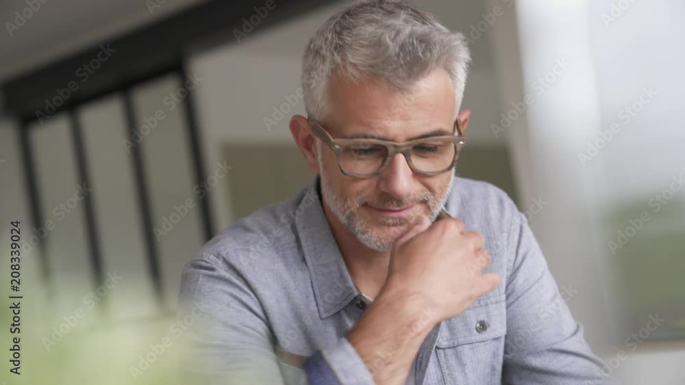 custom made wallpaper toronto digitalMiddle-aged guy with trendy eyeglasses relaxing at home