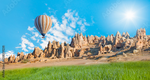 Hot air balloon flying over spectacular Cappadocia 