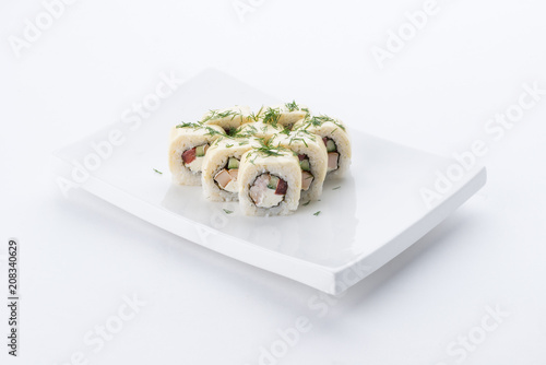 Sushi set and composition at white background. Japanese food restaurant, sushi maki gunkan roll plate or platter set.