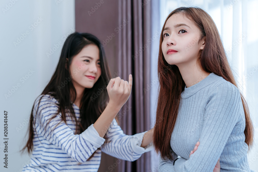 Same sex asian lesbian couple lover reconcile girlfriend argument in the bedroom at morning angry feeling, LGBT sexuality female living together at home. Same sex asian lesbian couple lover reconcile girlfriend argument in the bedroom at morning angry feeling, LGBT sexuality female living together at home.