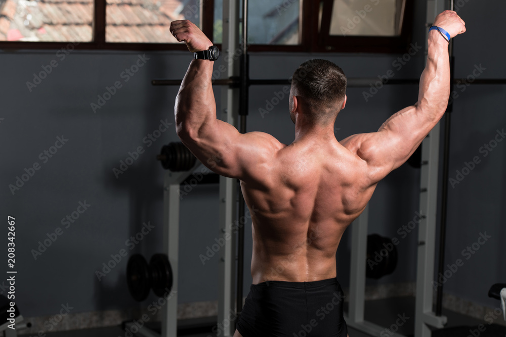 Serious Bodybuilder Standing In The Gym Serious Bodybuilder Standing In The Gym