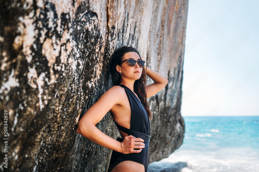 Pretty long hair bruntte girl relaxing on the beach Pretty long hair bruntte girl relaxing on the beach
