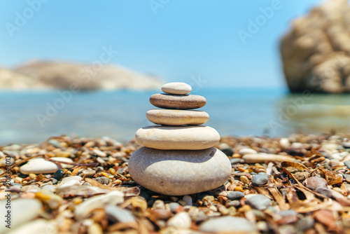 Stack of stones on the beach near sea