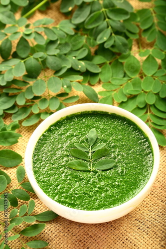 Homemade soup with moringa oleifera leaves and seeds.