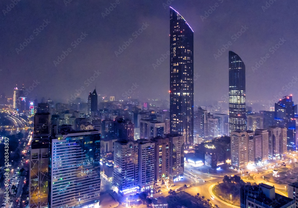 Naklejka premium Night aerial view of Abu Dhabi Downtown Skyscrapers, United Arab Emirates