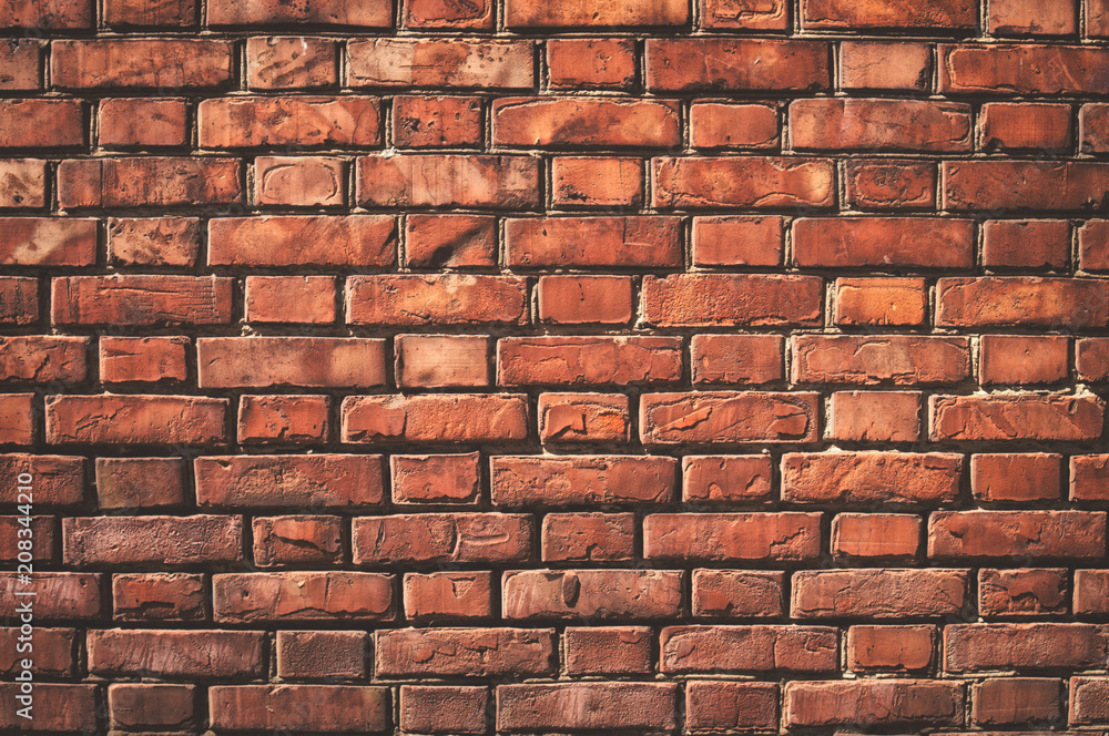 Texture of aged red brick wall with cracked weathered structure close-up for designer background Texture of aged red brick wall with cracked weathered structure close-up for designer background