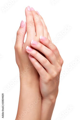 Beautiful female hands against white background  isolated