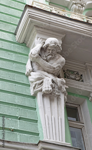 Atlant - balcony support, an element of the decor of the apartment building of the house of the Merchant Society of Moscow. The house was built in 1890 by architect Boris Freidenberg. Russia, Moscow, 