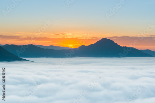 sunrise over mountain with fog  photo