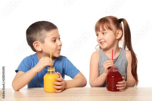 Cute little children drinki...
