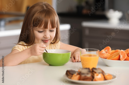 Funny little girl having br...