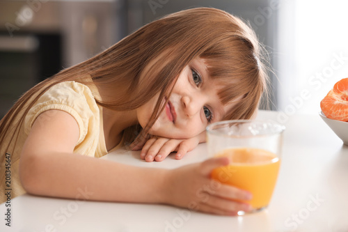 Funny little girl with citr...