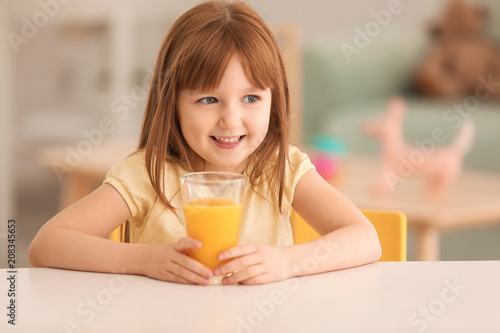 Funny little girl with citr...