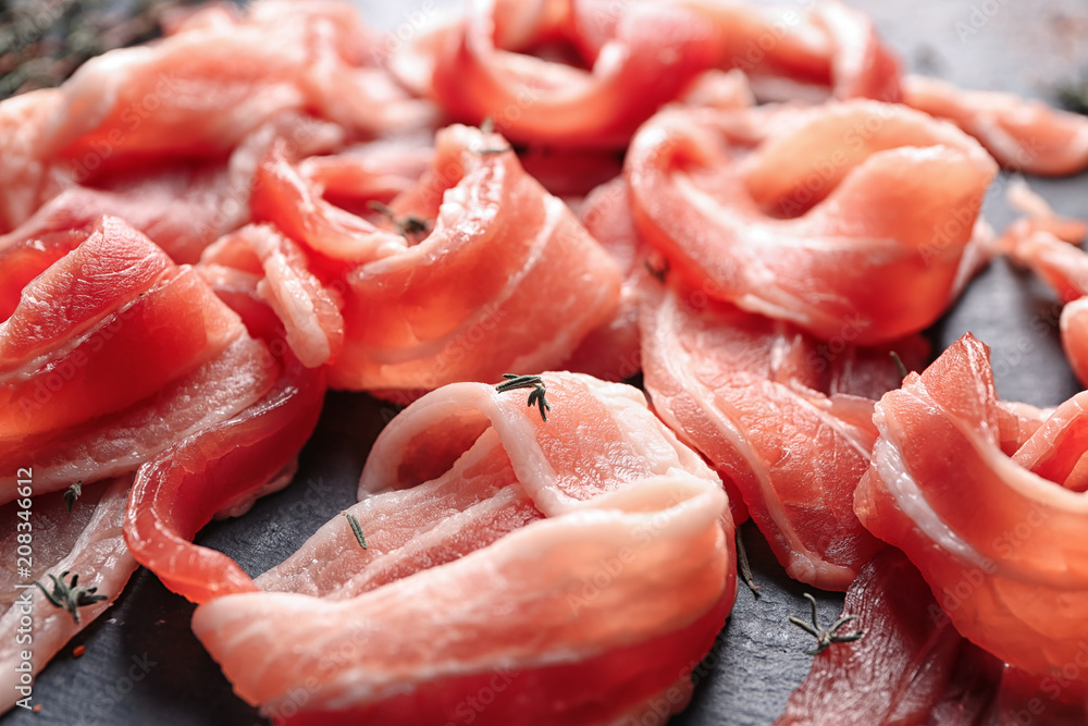 Rashers of bacon on plate, closeup Rashers of bacon on plate, closeup