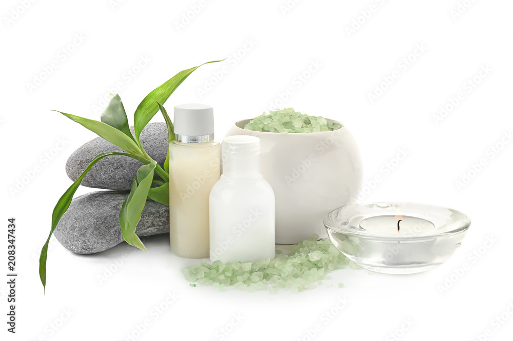 Spa composition with candle and toiletries on white background Spa composition with candle and toiletries on white background
