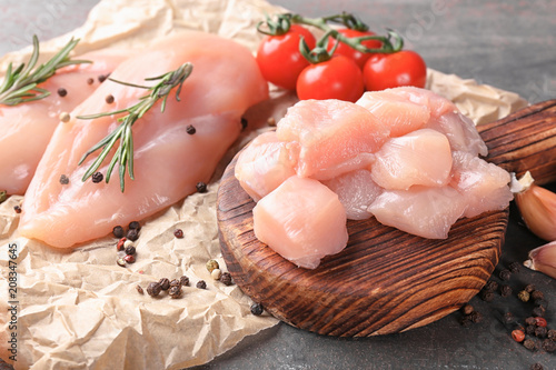 Raw cut chicken fillet on table