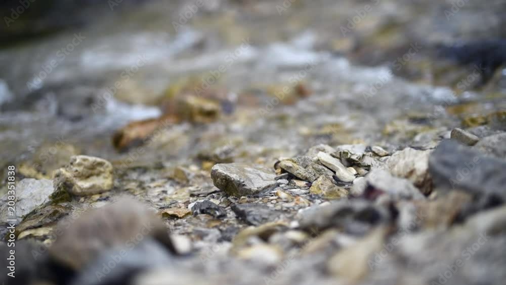River rocks with water stream at the background River rocks with water stream at the background