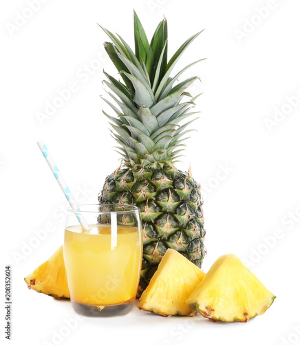 Fresh pineapple and glass with juice on white background
