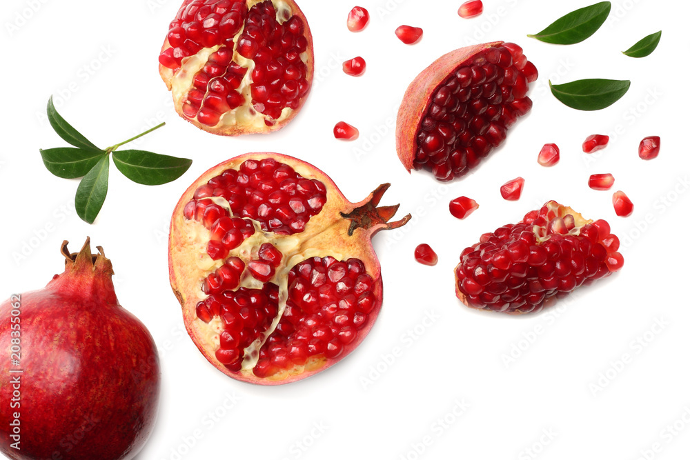 pomegranate fruit with green leaves isolated on a white background top view pomegranate fruit with green leaves isolated on a white background top view