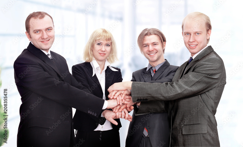 business team put their hands together. business team put their hands together.