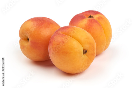 Fresh whole apricots, isolated on white background.