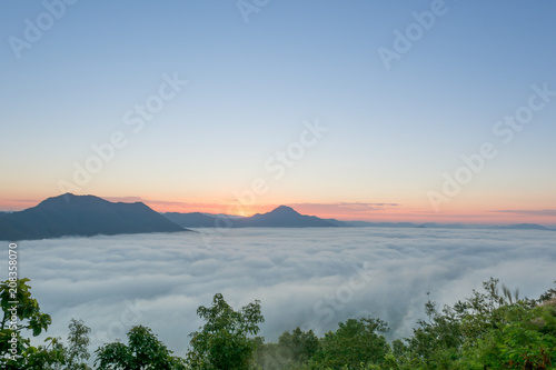 sunrise in the morning with fog over mountain