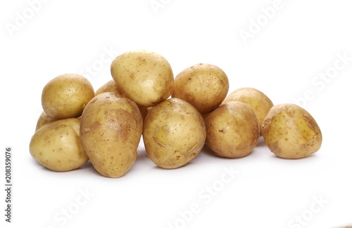 Young organic potatoes isolated on white background